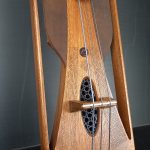 Guembri engraved electric gnawa player face
